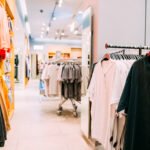 Many Male One-colour T-shirt On Hanger In Store Of Shopping Center.