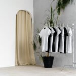 Row of black and white t-shirts hanging on rack, close up